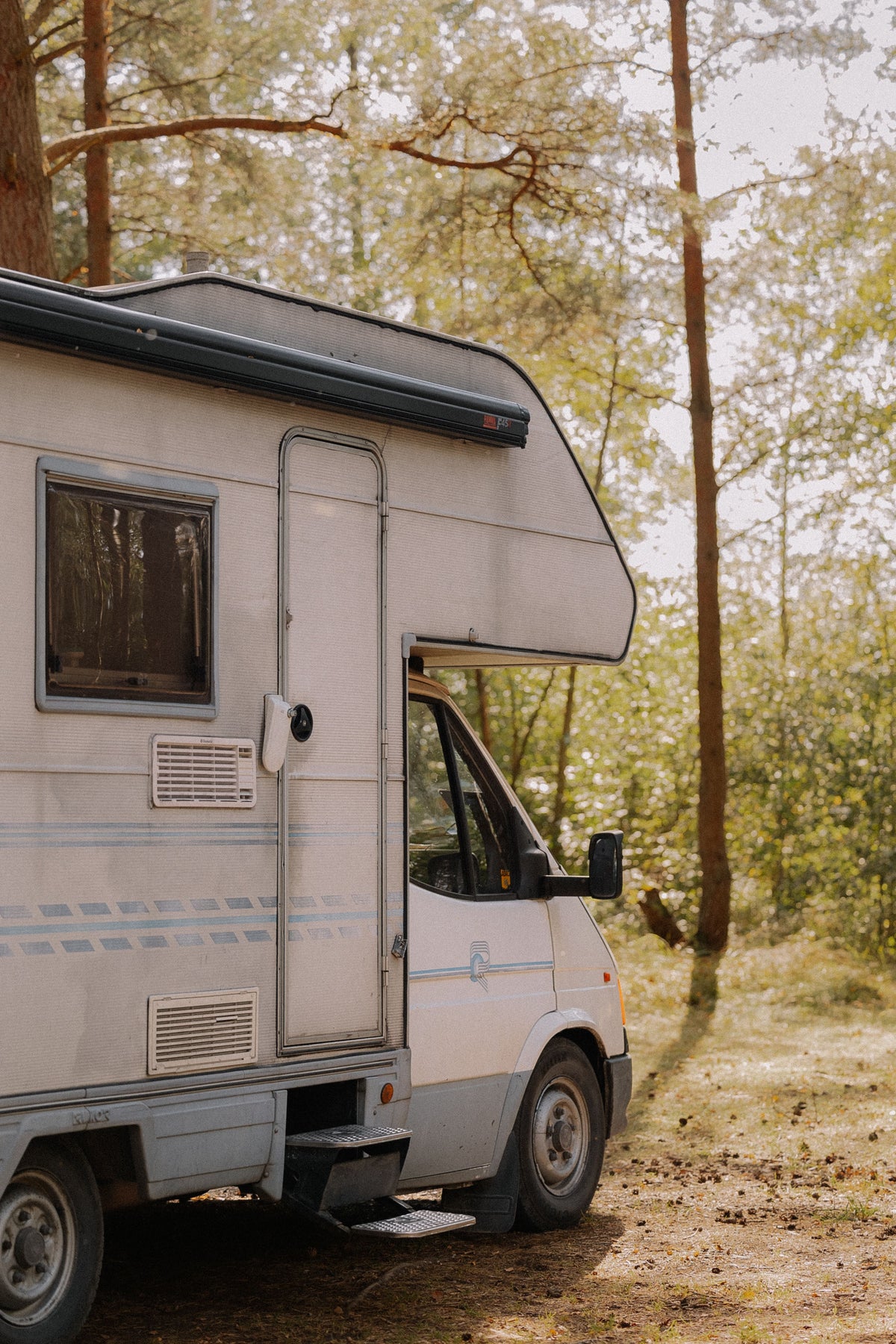 class c rv parked in the woods
