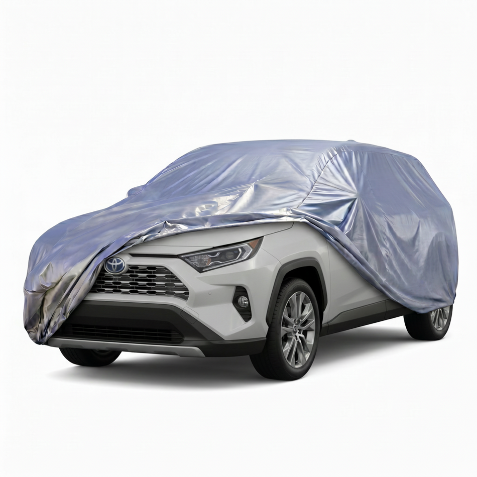 Car covered with a silver protective cover on a white background
