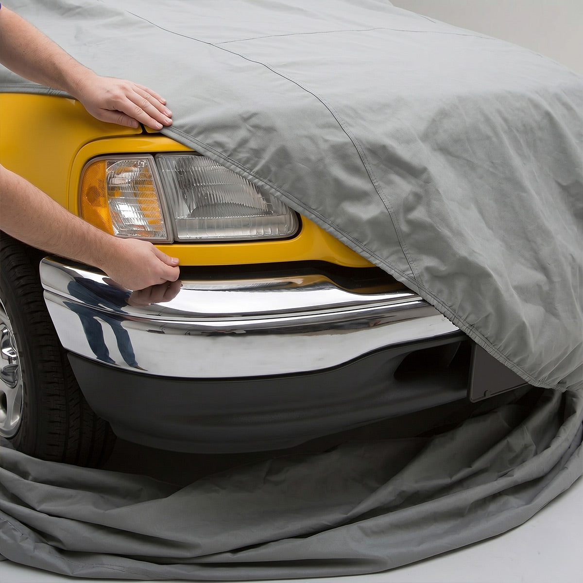 LINE UP THE FRONT BUMPER AND THE FRONT OF THE COVER