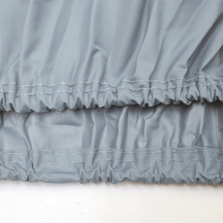 Close-up of gray ruffled fabric on a white background